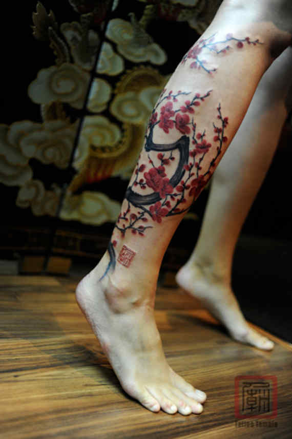 cherry blossom tree tattoo on leg