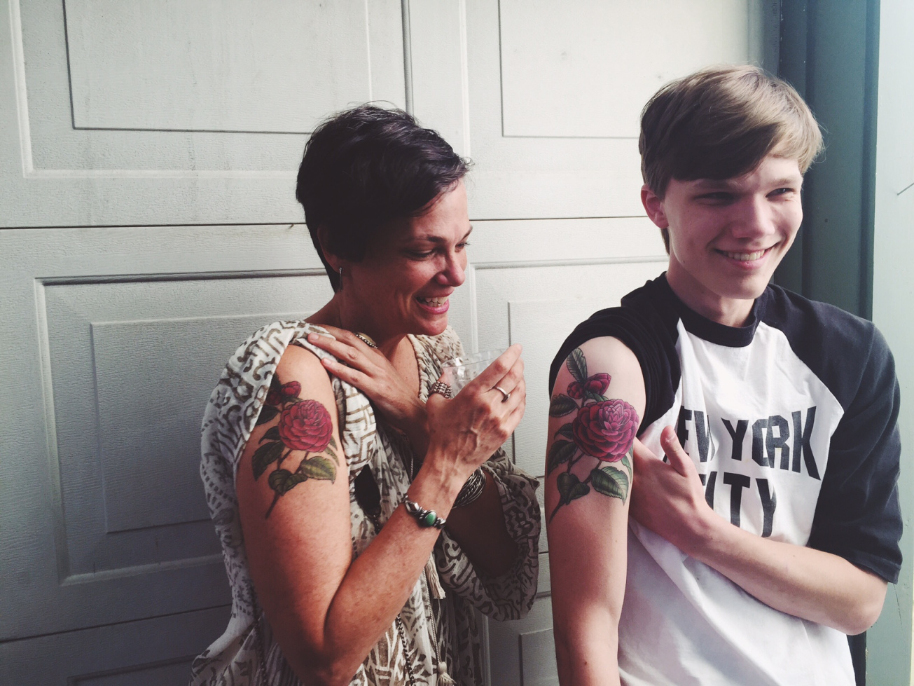 matching mother and son flower tattoos