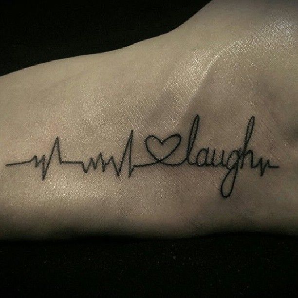 Celebrating life's heartbeat on live laugh love tattoo