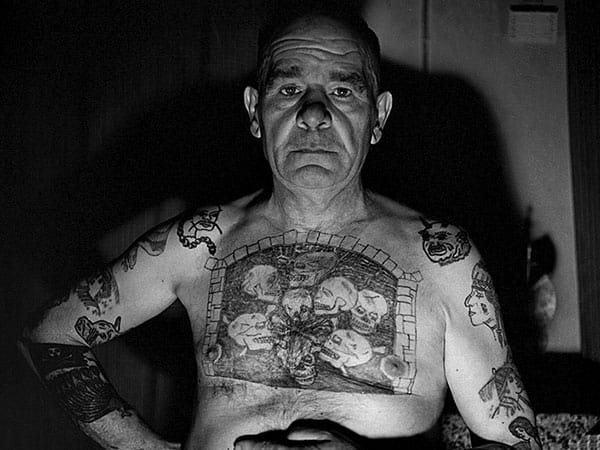 Old Man with Tattoos of Skulls