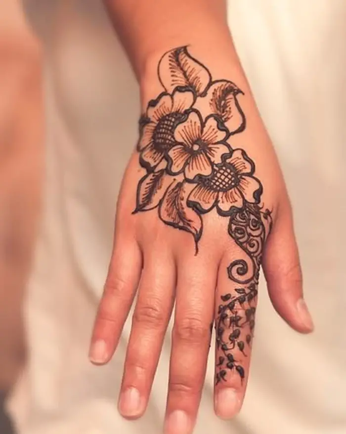 flower in bloom hand tattoos