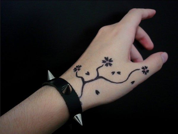 tiny bloom hand tattoos
