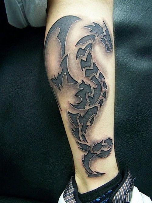 scribbled dragon leg tattoos for men