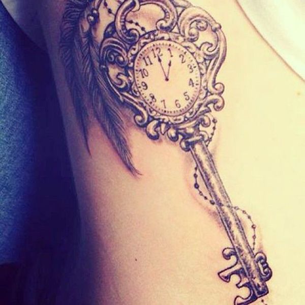 key with clock face design tattoo