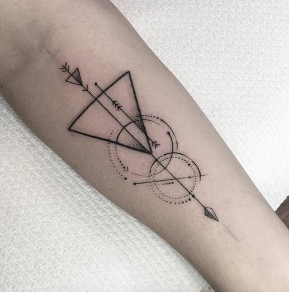 Geometrical arrow tattoo with meaning