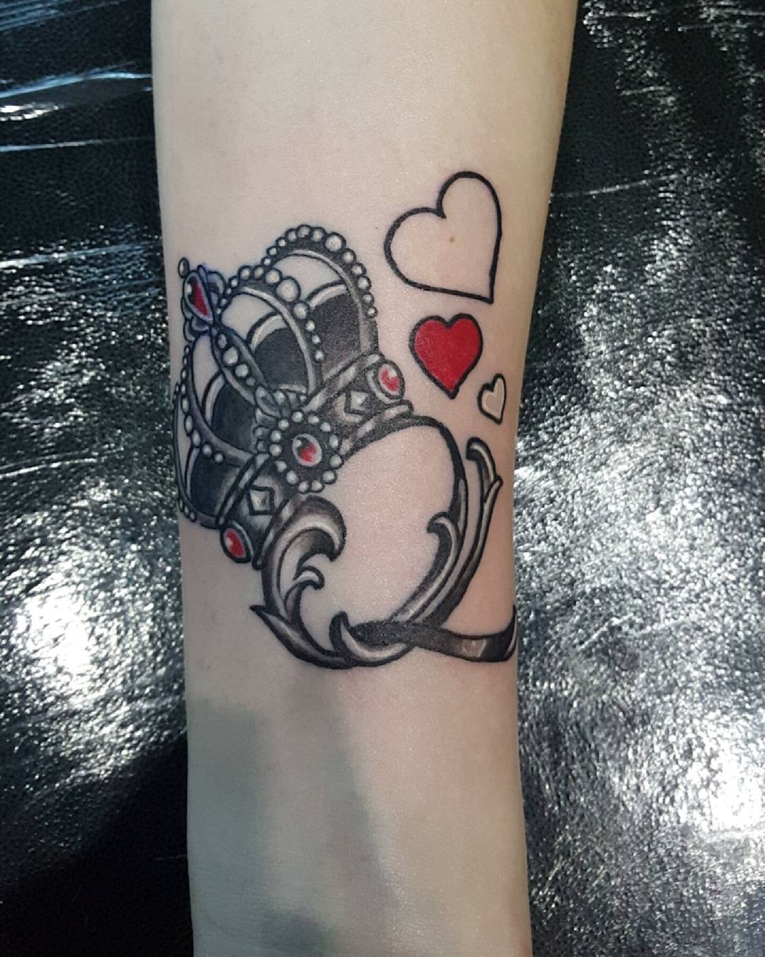 three hearts and a crown tattoo