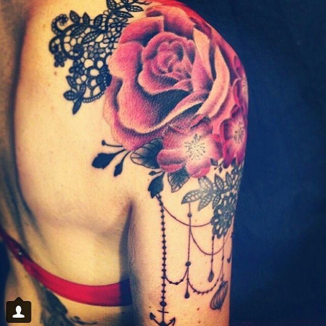 tattoos of red roses on shoulder