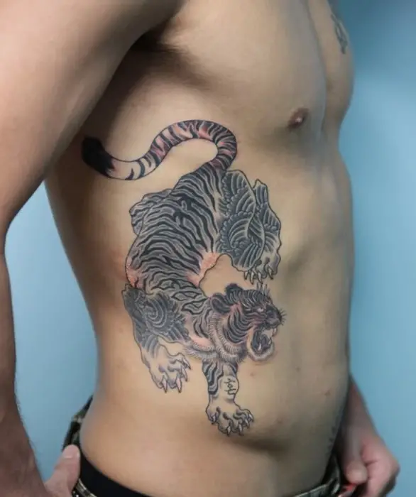 prowling tiger side tattoos for men