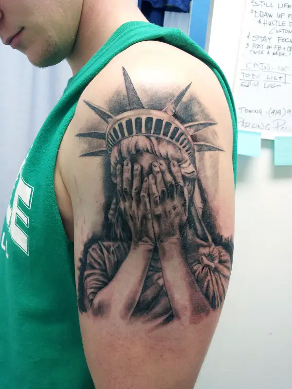 statue of liberty face tattoo