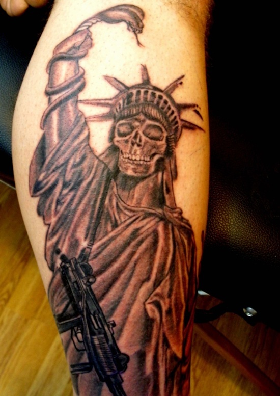 spooky tattoo of the Statue of Liberty with a skeleton face