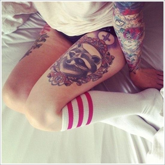 raccoon thigh tattoos for women