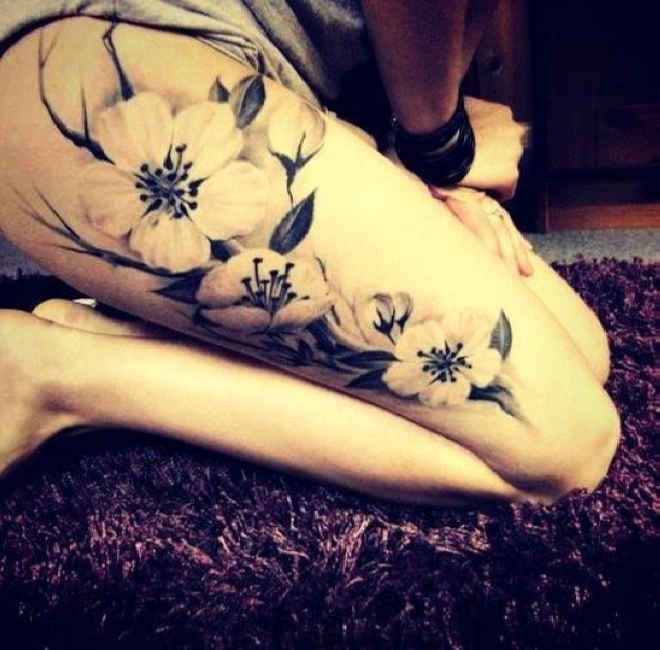 white hibiscus thigh tattoos for women