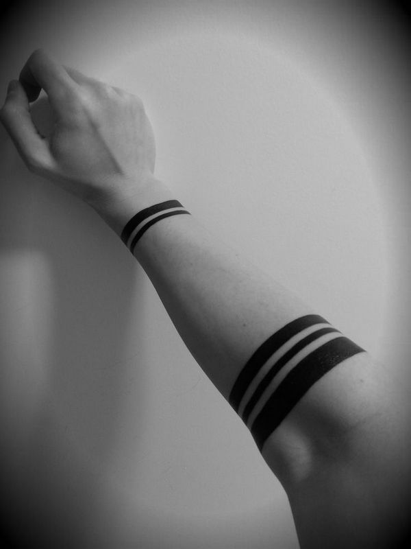 solid wrist and armband tattoos