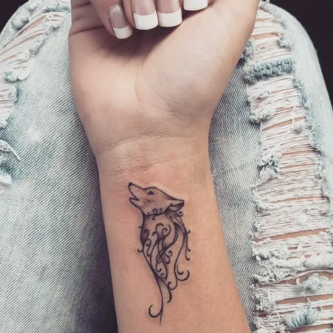 howling wolf wrist tattoos for women