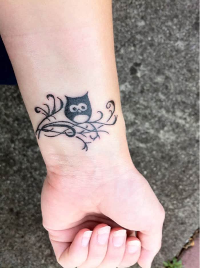 cute owl on branch tattoos on wrist