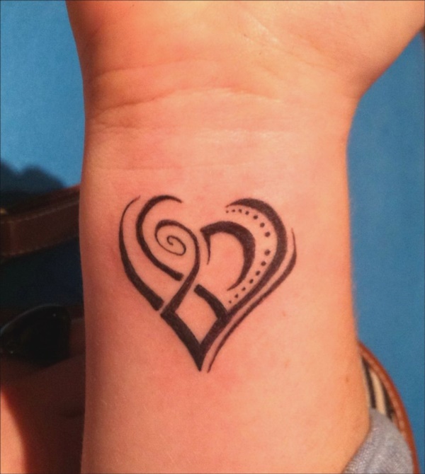 dramatic heart tattoo on wrist