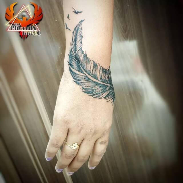 feather wrist tattoos