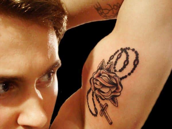inner bicep rose tattoo