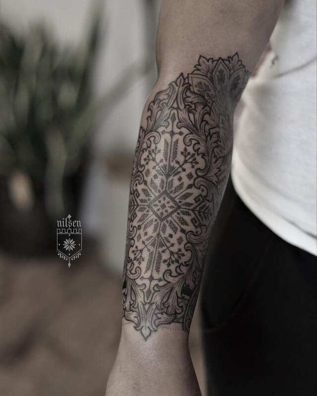 Filigree with blossoms line work by Laura Jade TattooNOW