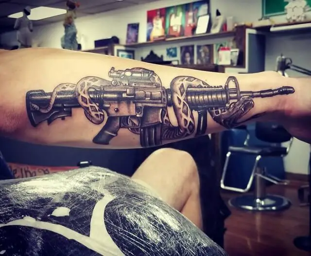 snake guns and tattoo