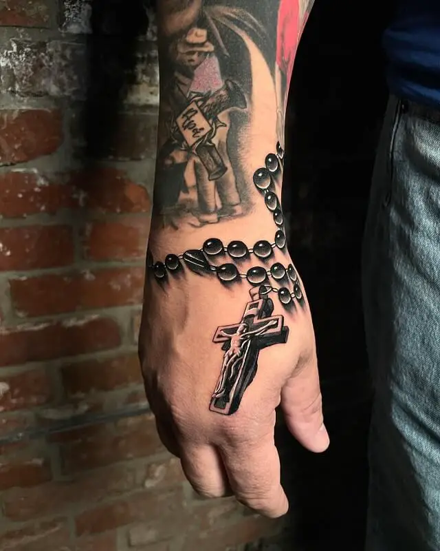 religious hand tattoos