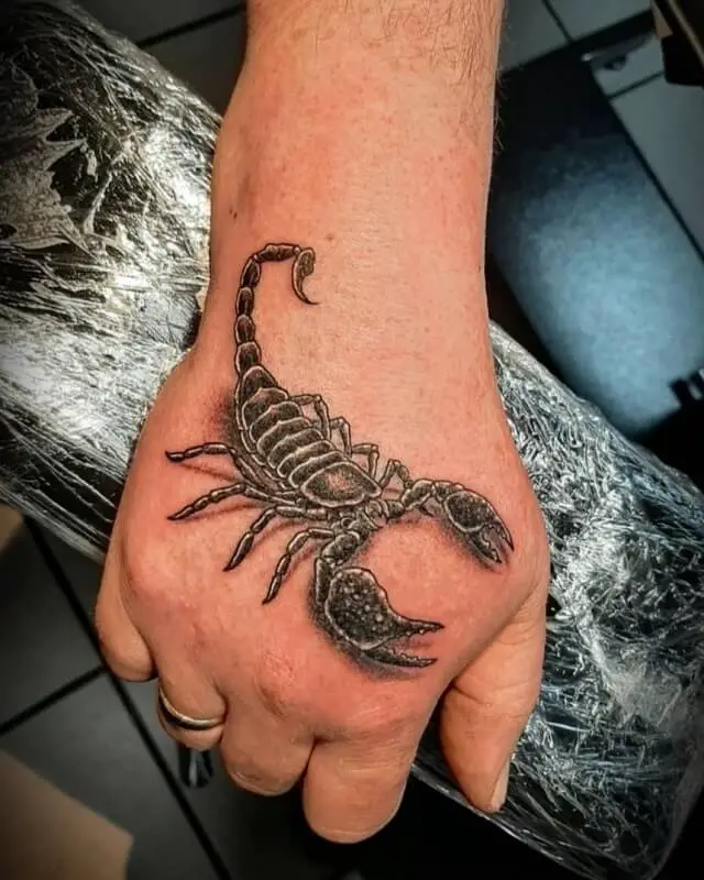 scorpion hand tattoos