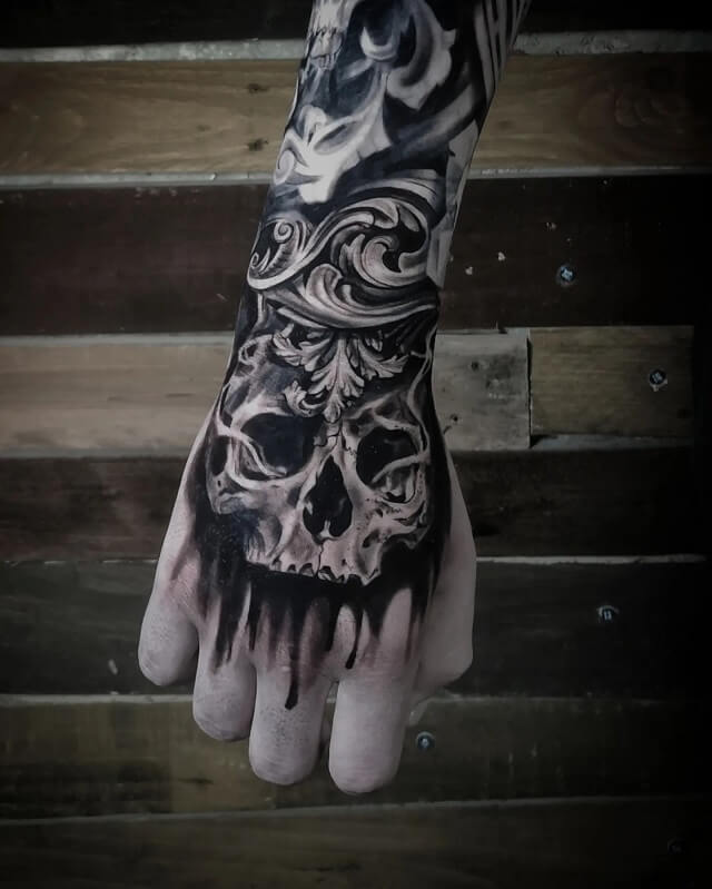 skull hand tattoos