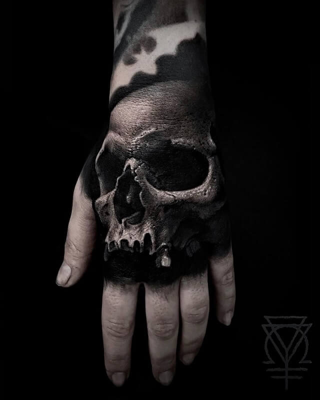 skull hand tattoos