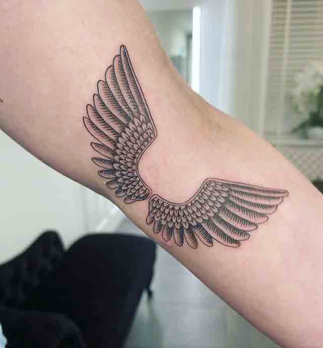 angel wings tattoo on arm