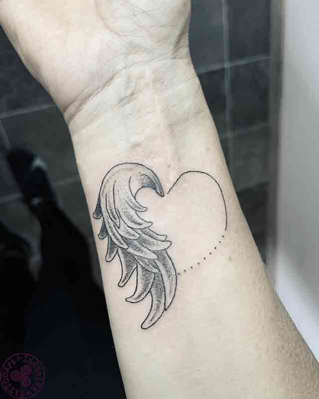 Angel-Wings-Tattoo-On-Wrist-(1)