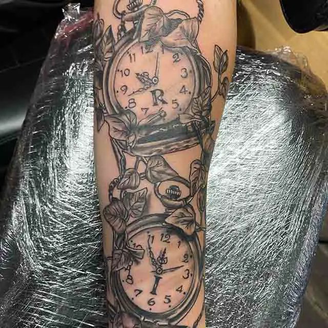 melting clock tattoo sleeve