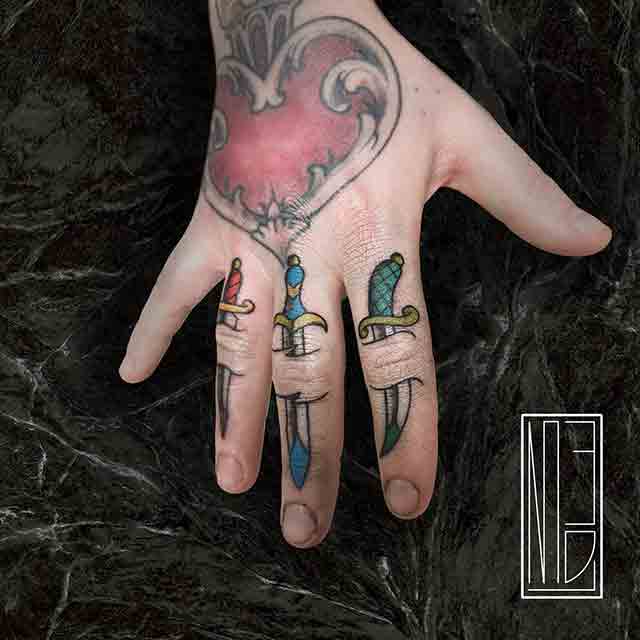 Daggers-Tattoos-In-A-Finger-For-Woman-(1)