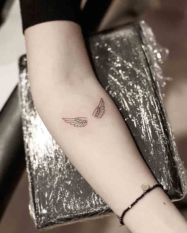 Heart Shaped Angel Wings Tattoo On Wrist