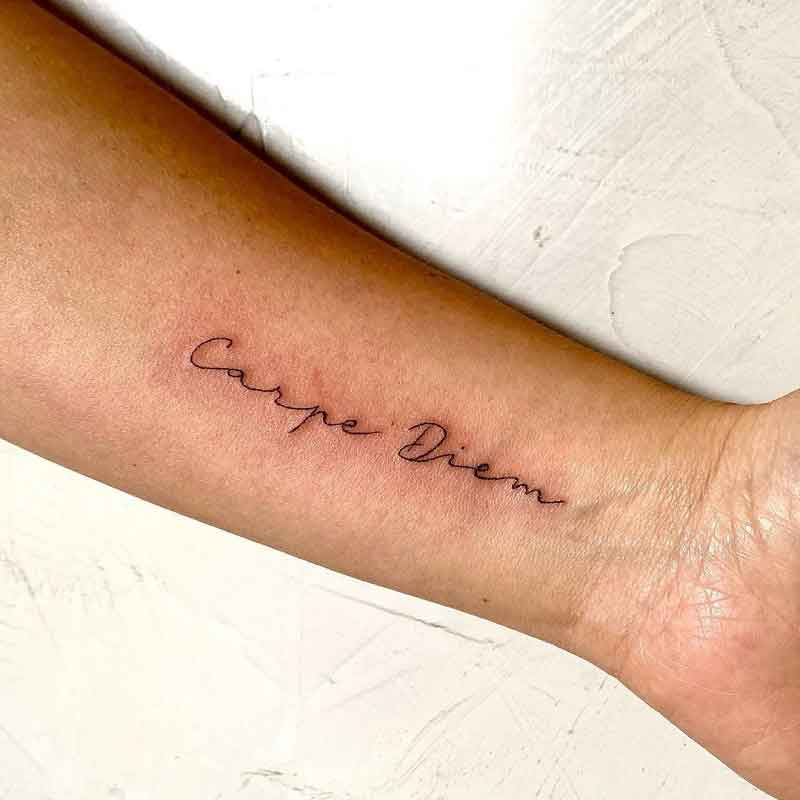 Carpe diem tattoo on the ankle