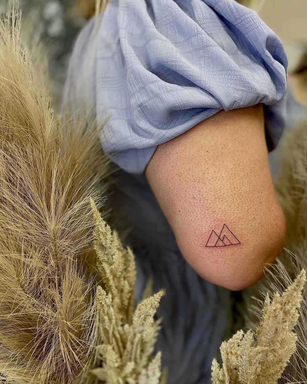 A minimalist mountains landscape tattoo  Tattoogridnet