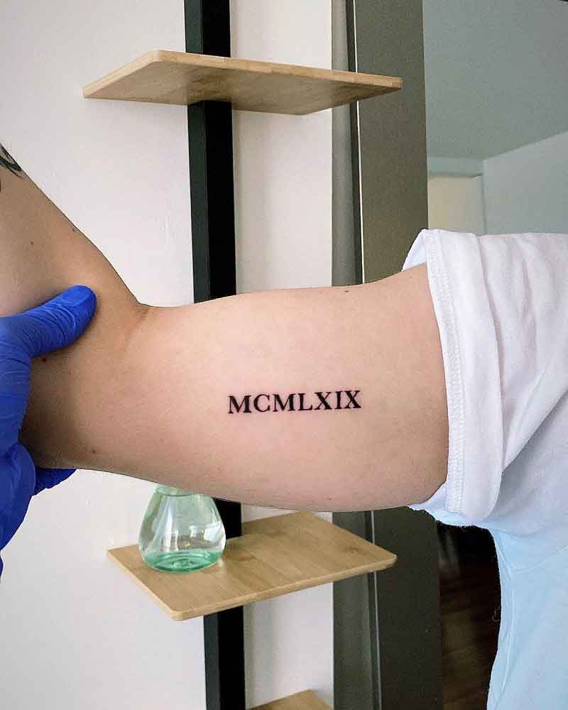 Roman Numeral Bicep Tattoo 2