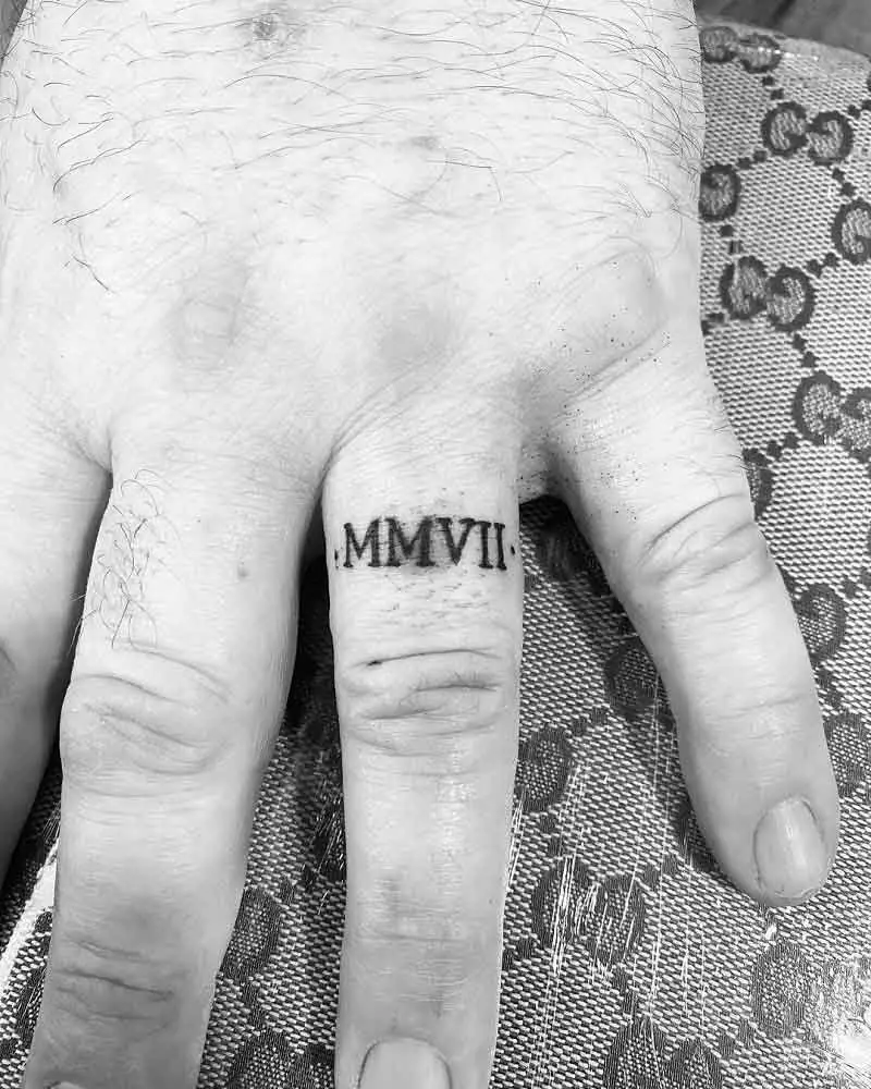 Roman Numeral Ring Tattoo 1