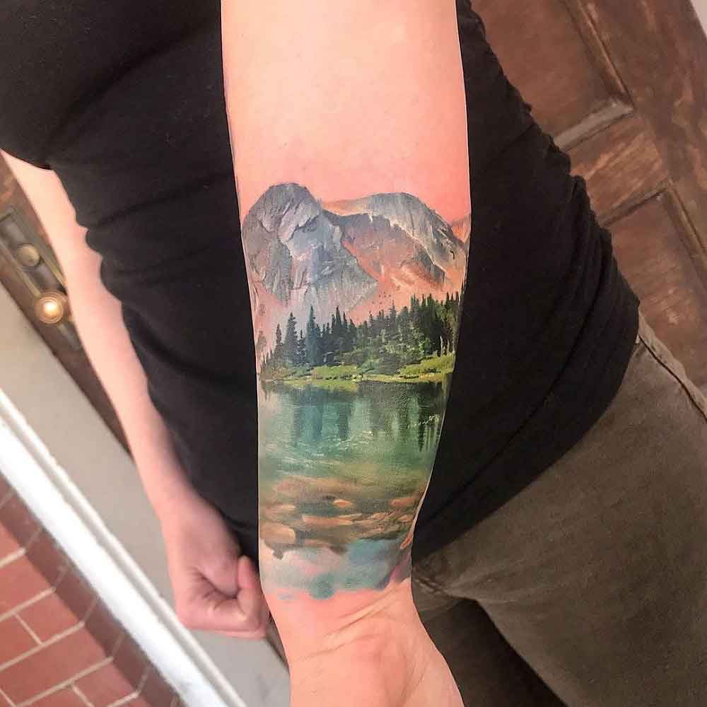 Showcase your adventurous spirit with a mountain range tattoo