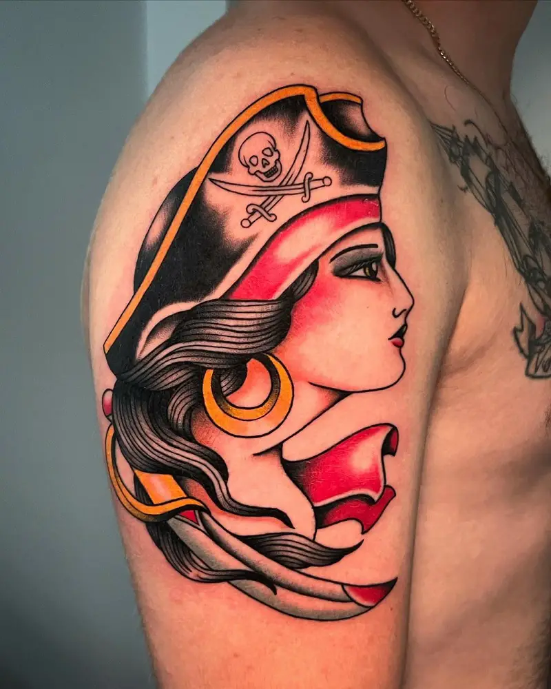 Traditional pirate pinup tattoo on inner forearm