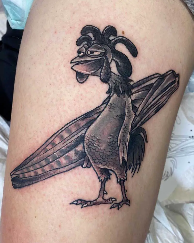 Chicken Joe from Surfs Up tattooed on the upper arm