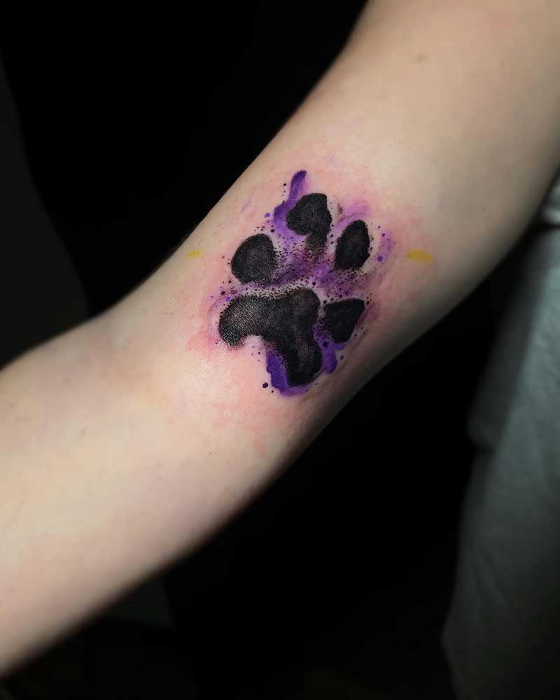 dog paw print tattoo on wrist