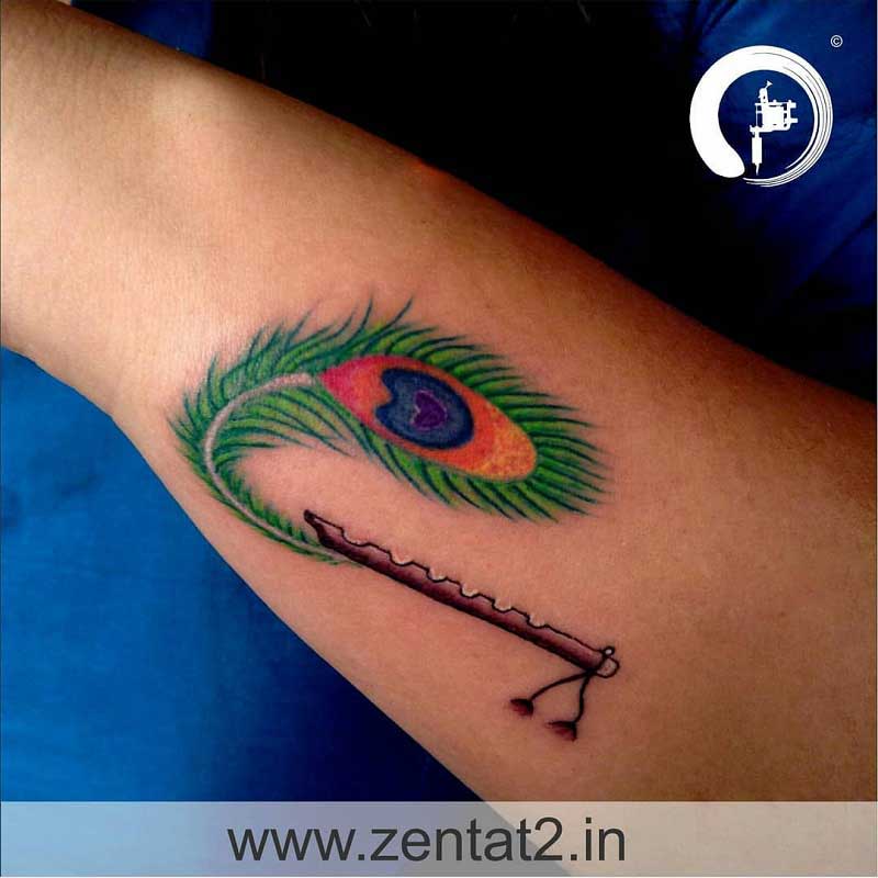 flute-peacock-feather-tattoo-2