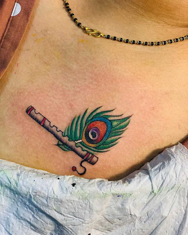 flute-peacock-feather-tattoo-3
