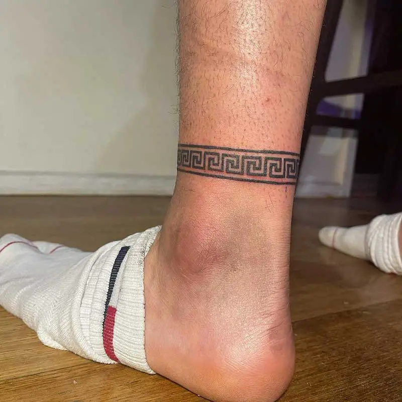 Traditional ankle cuff tattoo.