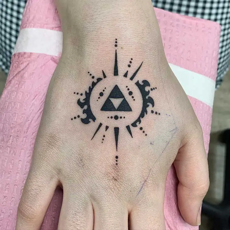 Tattoo uploaded by omnixgrrl  I look at this daily to remember who I am  zelda TheLegendOfZelda Triforce handtattoo  Tattoodo