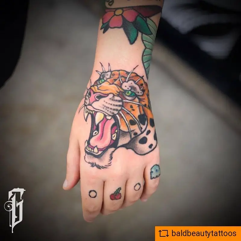 Leopard Hand Tattoo 1