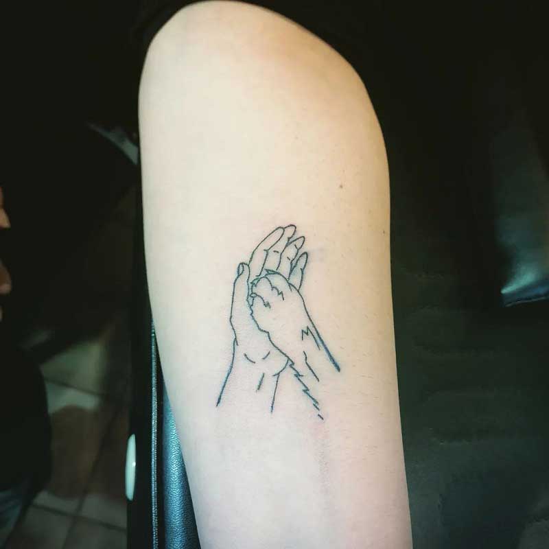 hand-holding-dog-paw-tattoo--1