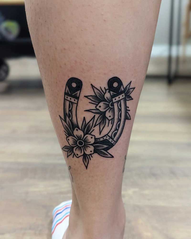 This is a horseshoe and flowers Apparently  rshittytattoos