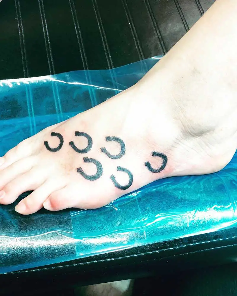 horseshoe tattoo on foot