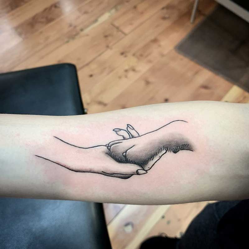 Tattoo uploaded by Devon Barchus  Ink 4 human hand holding dog paw   Tattoodo